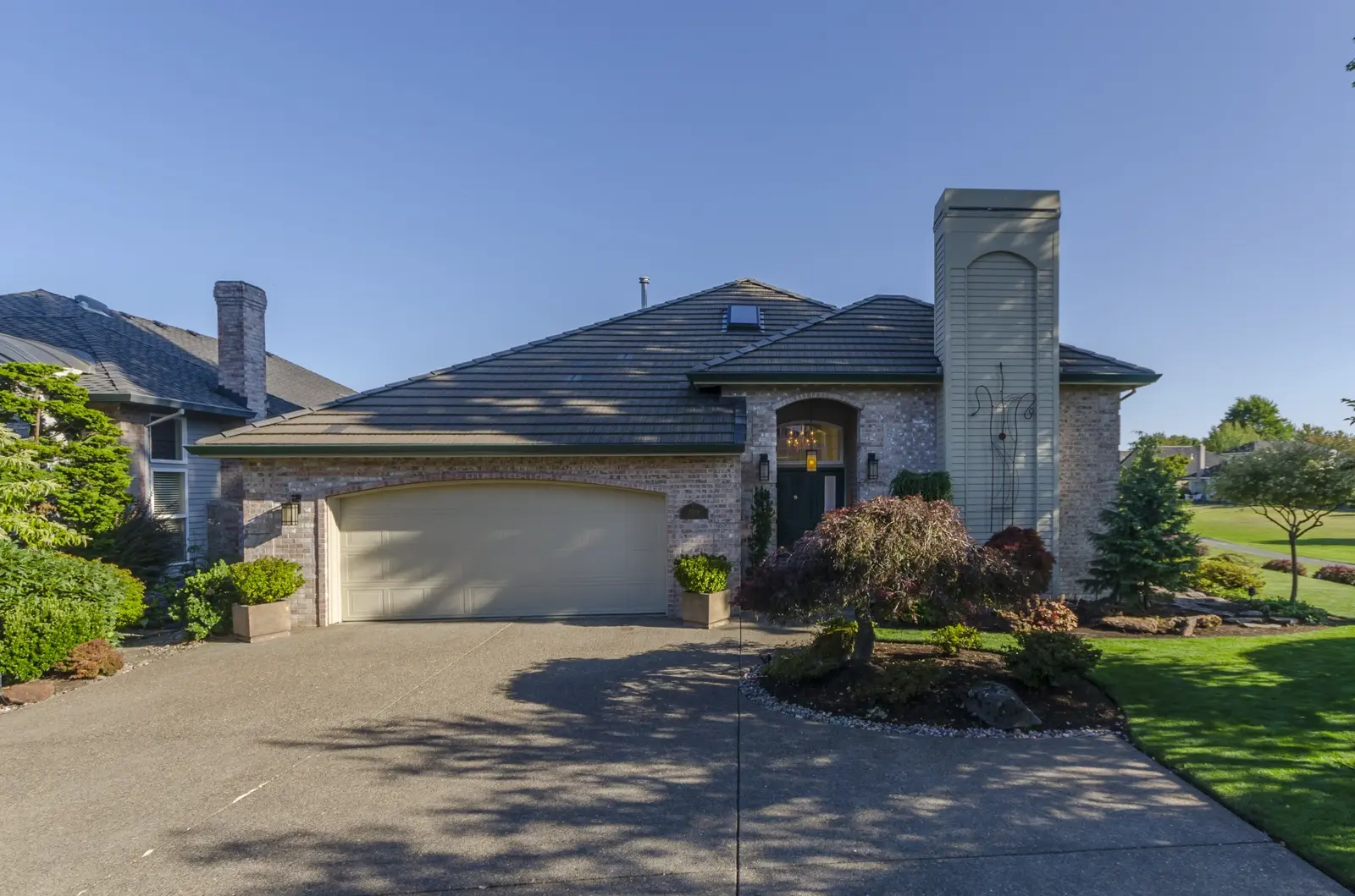Brick home with landscaped front entry